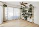 Bright sitting room with decorative shelving and ample natural light from large windows at 1315 Chatsworth Ct, Las Vegas, NV 89142