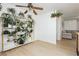 Light-filled living space featuring open shelving for plants and views to sitting area at 1315 Chatsworth Ct, Las Vegas, NV 89142