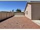 View of the backyard featuring gravel, a fenced perimeter, and privacy at 1907 Thunder Storm Ave, North Las Vegas, NV 89032