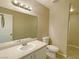 This bathroom features neutral walls, tile flooring, a large mirror, and a vanity with a sink at 1907 Thunder Storm Ave, North Las Vegas, NV 89032