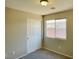 This bedroom features neutral walls, carpet flooring, and a closet with sliding doors at 1907 Thunder Storm Ave, North Las Vegas, NV 89032