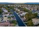 An elevated view shows single-Gathering homes in a community with mature trees that create a peaceful environment at 2104 Inverness Dr, Henderson, NV 89074