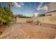 Picturesque backyard featuring desert landscaping, a brick pathway, and a decorative wall at 2104 Inverness Dr, Henderson, NV 89074