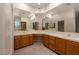 Bright bathroom features double sinks, large mirrors, and spacious vanity at 2104 Inverness Dr, Henderson, NV 89074