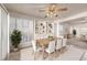 Bright dining room features white shelving, natural light, and a ceiling fan at 2104 Inverness Dr, Henderson, NV 89074
