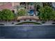 A lovely sign indicates the Palm Valley Estates community with landscaping and flowers at 2104 Inverness Dr, Henderson, NV 89074