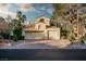 Two-story home with three-car garage and desert landscaping at 2104 Inverness Dr, Henderson, NV 89074