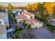 Stunning home with a red-tile roof, attached garage, and lush landscaping at 2104 Inverness Dr, Henderson, NV 89074