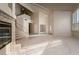 Spacious living room featuring a fireplace, open staircase, and neutral color palette at 2104 Inverness Dr, Henderson, NV 89074