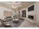 Comfortable living room featuring a fireplace, modern furniture, and stylish decor at 2104 Inverness Dr, Henderson, NV 89074