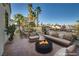Spacious outdoor patio features a modern fire pit and comfortable seating at 2104 Inverness Dr, Henderson, NV 89074