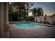 Refreshing pool featuring a baja shelf and desert landscaping to create a relaxing atmosphere at 2104 Inverness Dr, Henderson, NV 89074
