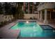 Sparkling pool and spa offer a refreshing escape, complemented by an expansive patio and lush landscaping at 2104 Inverness Dr, Henderson, NV 89074