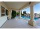 Covered patio area provides shade near the pool and desert landscaping at 2104 Inverness Dr, Henderson, NV 89074