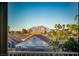 A scenic view of the surrounding neighborhood and distant mountains from a window at 2104 Inverness Dr, Henderson, NV 89074