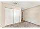 Bedroom with neutral carpet, white closet doors and wall colors at 2232 Aspen Mirror Way # 103, Laughlin, NV 89029