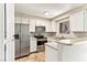 Kitchen featuring stainless steel appliances and white cabinets at 2232 Aspen Mirror Way # 103, Laughlin, NV 89029