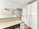 Kitchenette with bar seating area, featuring a dishwasher, and extra cabinet space at 2232 Aspen Mirror Way # 103, Laughlin, NV 89029