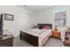 Cozy bedroom featuring carpeted floors, natural light, and simple decorations at 2243 Albury Ave, North Las Vegas, NV 89086