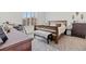 Well-lit bedroom with a neutral color palette and comfortable furnishings at 2243 Albury Ave, North Las Vegas, NV 89086