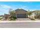 Charming single story home features a brick paved driveway and desert landscaping at 2243 Albury Ave, North Las Vegas, NV 89086
