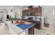 Modern kitchen featuring granite countertops, stainless steel appliances, and wooden cabinets at 2243 Albury Ave, North Las Vegas, NV 89086