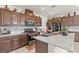 Modern kitchen featuring stainless steel appliances, stone countertops, and stylish cabinetry at 2243 Albury Ave, North Las Vegas, NV 89086