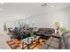 Living room featuring tile floors, large windows, and comfortable seating at 2243 Albury Ave, North Las Vegas, NV 89086