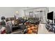 Comfortable living room with plush seating, tile floors, and large windows at 2243 Albury Ave, North Las Vegas, NV 89086
