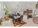 Open concept living and dining room area with natural light from large windows at 2243 Albury Ave, North Las Vegas, NV 89086