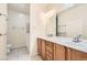 Bathroom features double sinks, ample storage, and a large mirror at 2409 Garganey Ave, North Las Vegas, NV 89084