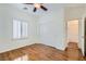 Bright bedroom with wood floors, a closet, and a window with shutters at 2409 Garganey Ave, North Las Vegas, NV 89084