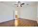 Bedroom boasts wood floors and an open doorway to an ensuite bathroom at 2409 Garganey Ave, North Las Vegas, NV 89084