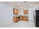 Charming kitchen featuring wood cabinets, stainless steel appliances, and a window over the sink at 2409 Garganey Ave, North Las Vegas, NV 89084