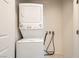 Stackable white washer and dryer set installed with utility connections at 2409 Garganey Ave, North Las Vegas, NV 89084