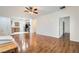 Open-concept living area with wood floors connects seamlessly to the kitchen, offering easy access and flow at 2409 Garganey Ave, North Las Vegas, NV 89084