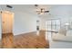 Spacious living room with dark wood floors, shuttered windows, and neutral walls creates a relaxing ambiance at 2409 Garganey Ave, North Las Vegas, NV 89084