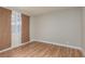 Bright bedroom featuring laminate wood flooring and a large window at 257 N Lamb Blvd # E, Las Vegas, NV 89110