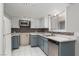 Modern kitchen boasts stainless appliances, updated countertops, and white upper cabinets at 257 N Lamb Blvd # E, Las Vegas, NV 89110