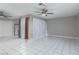A view of the entryway and kitchen in a bright living room with tile flooring at 257 N Lamb Blvd # E, Las Vegas, NV 89110