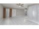 Open concept living room is bright with tile flooring and neutral paint at 257 N Lamb Blvd # E, Las Vegas, NV 89110