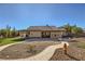 Spacious backyard featuring hardscape, mature trees and a tidy green lawn at 263 Baring Cross St, Henderson, NV 89074