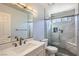 Bright bathroom with single vanity, white countertops and a glass-enclosed shower at 263 Baring Cross St, Henderson, NV 89074