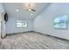 Vaulted ceiling bedroom with a ceiling fan, wood-look flooring, and natural light at 263 Baring Cross St, Henderson, NV 89074