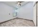 Well-lit bedroom features wood-look floors, ceiling fan, and a closet at 263 Baring Cross St, Henderson, NV 89074