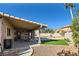 Covered patio featuring exterior fan, stone pavers and artificial turf at 263 Baring Cross St, Henderson, NV 89074