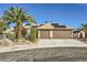 Charming home with a three car garage, desert landscaping, and solar panels at 263 Baring Cross St, Henderson, NV 89074