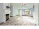Spacious living room with fireplace, wood tile flooring, and abundant natural light at 263 Baring Cross St, Henderson, NV 89074