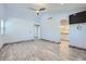 Spacious main bedroom with wood-look floors, ceiling fan, and ensuite bathroom access at 263 Baring Cross St, Henderson, NV 89074