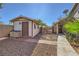Backyard shed featuring wood construction with neutral colored paint and a tile roof at 263 Baring Cross St, Henderson, NV 89074